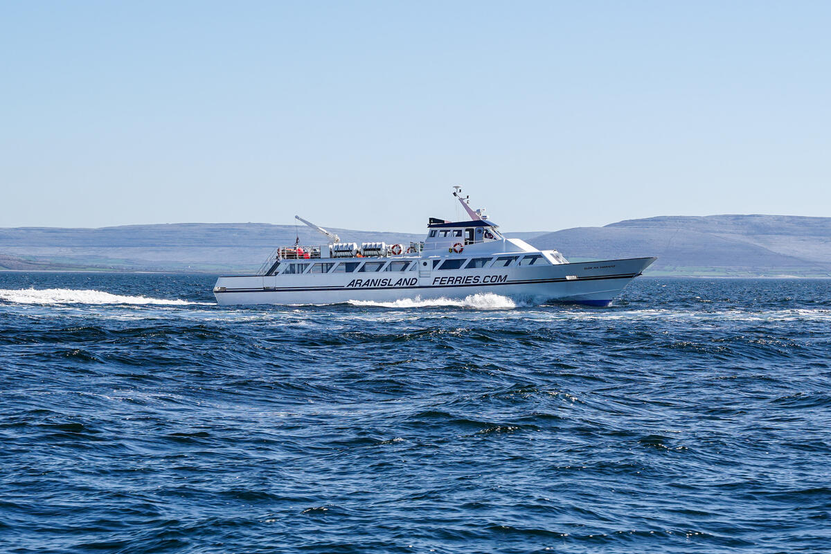 Aran Islands ferry with views of the rugged coastline and Atlantic waters in the background.