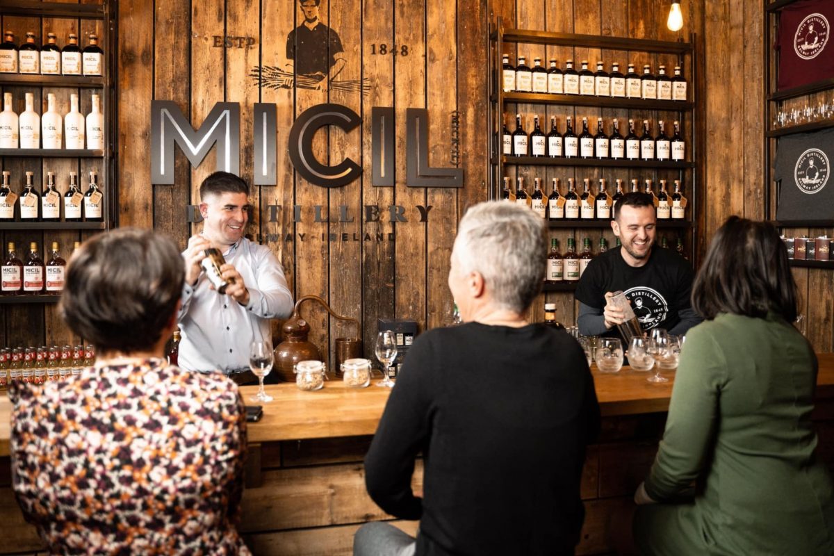 Visitors enjoying a guided tasting experience at Micil Distillery in Galway