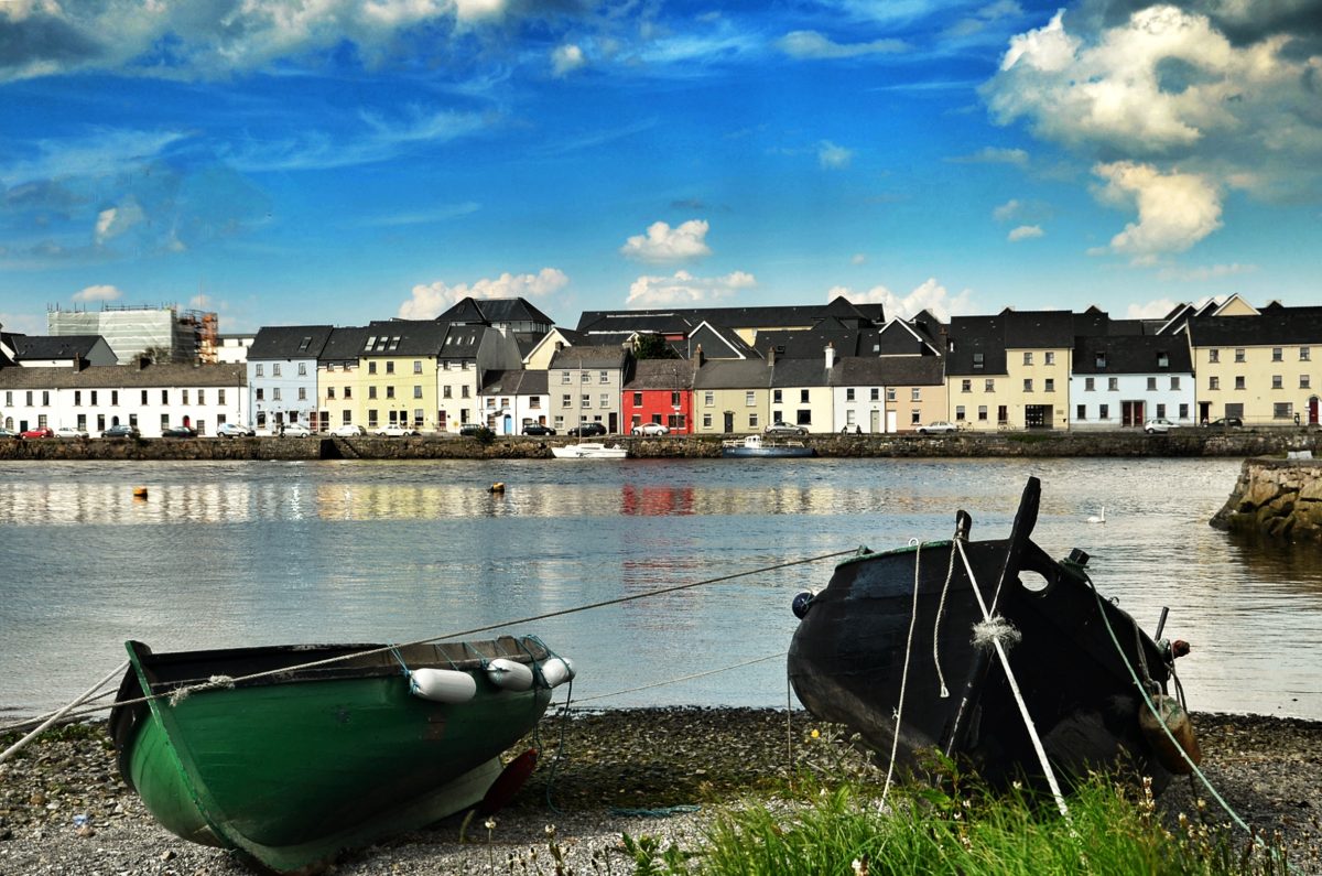 Traditional Galway hooker boats on the shoreline in Salthill overlooking Galway Bay